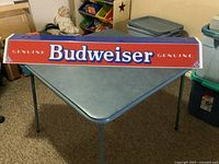 Full view of Budweiser light shade on table showing length and graphics