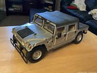 Left front view of silver 1:18 Hummer H1 diecast model on table