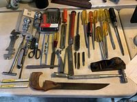 Overview of all hand tools spread on table