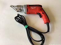 Full view of Milwaukee corded shear with cable