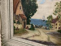 Lower left section showing cottage, fence, shoreline, boats and signature area