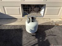 Front view of dual-burner heater on propane cylinder