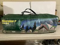 Front of packed Woods Riverview 7 tent showing branding and forest graphic