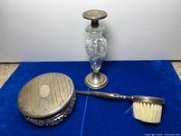 Overall view of three vanity set pieces on blue background