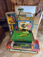 Stacked board games and pogo stick overview