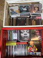Top view of both crates showing mix of CDs such as Classic Sinatra, Chet Baker, Kenny Rogers, George Benson, Dee Dee Bridgewater