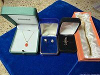 Group shot showing all four items in their boxes