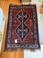 Full view of rug showing overall design, colors and size tag