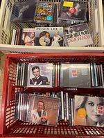Two crates filled with jazz CDs, many sealed