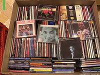 Top view of box showing numerous CD spines and several jazz titles on top such as John Coltrane Giant Steps