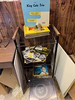 Cart with jazz LPs on shelves and Lloyd’s turntable at bottom