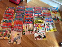 Full layout of 26 comic books showing covers and titles