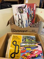 Box containing Aurora AFX Spiral Challenge set and other items