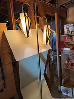 Full view of pole lamp with both shades lit