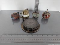 Front view of all items with rulers for scale