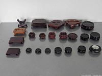 Full lot view of assorted 22 wooden display stands and risers