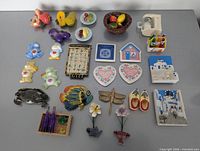 Full layout of 24 assorted refrigerator magnets
