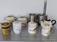 Entire nine-piece lot arranged on table showing all items and patterns