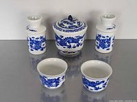 Full set of five blue-and-white dragon motif porcelain pieces