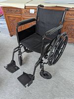 Front angled view showing complete wheelchair setup