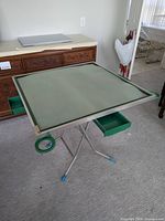 Full view of folding Mahjong table showing drawers and holders extended