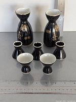 Full set showing 2 carafes and 6 cups with rulers for scale