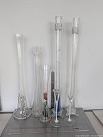 Group shot of all seven glass pieces with ruler for scale