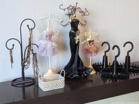 All jewelry displays, hangers and basket on shelf