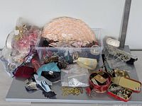 Overview of entire lot showing plastic box, lace appliques, tins, beads, trims