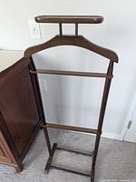 Full view of mahogany wood valet stand