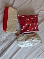 Red polka-dot vinyl pouch, canvas pouch with red base, clear vinyl logo pouch