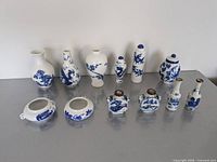 all twelve blue and white porcelain miniatures on table