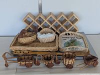 Front view of entire lot showing wine rack at back, two rectangular trays, assorted small baskets and miniature carts