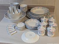 Entire dinnerware set grouped on counter