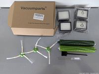 Full set showing box, four filters, three side brushes, two rollers, cleaning brush, screwdriver