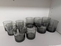 All 11 smoky gray tumblers grouped to show quantity and consistency