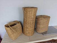 Three bamboo wicker baskets of different shapes shown together