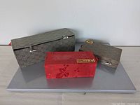 All three silk brocade boxes front view