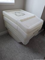 Stacked view of bins showing recycling symbol on top lid