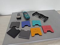 Lot overview: two mobile phones, eight MiniDisc cases, black holder