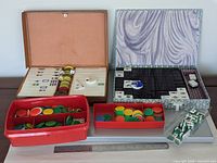 All items: two mahjong sets in cases, chips in tray, mini tiles bag, ruler for scale