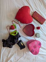 All items laid out showing pillow, boxes, tray, pouches, tin