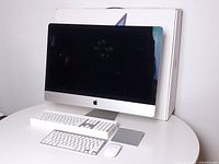 iMac with accessories and box