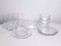 Full view of all 15 clear octagonal glass pieces: six tall glasses, one large bowl, four small bowls stacked, four small plates