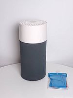 Full view of Blueair Blue Pure 411 air purifier with packaged blue sleeve