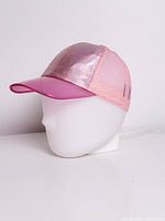 Side view of lamp with cap showing mesh and visor