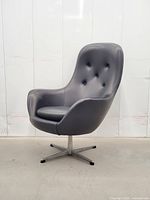 front view showing chair shape, upholstery, base