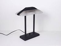 Full view of Sonneman table lamp, cord visible