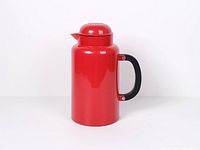 Front view of red Bodum thermo jug showing handle and spout
