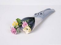 Wall vase with flowers angled view